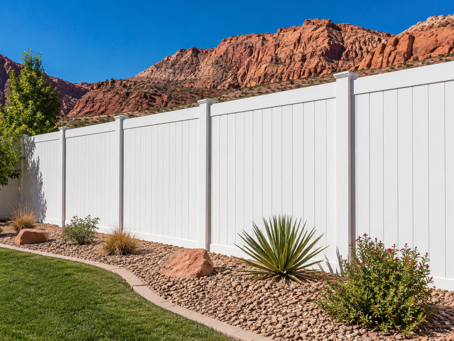 Tall white vinyl privacy fence installation in Southern Utah backyard